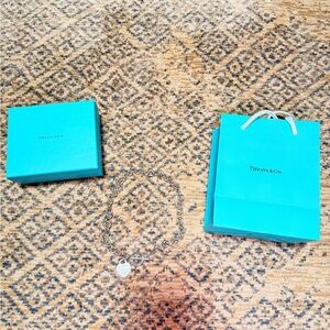 Authentic Tiffany & Co. Silver Heart Charm Necklace with Blue Packaging